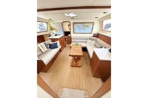 Slide: The Image of Interior of 2006 Endeavour 44 TrawlerCat with cozy seating and nautical decor. - 11
