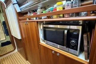 Slide: The Image of 2006 Endeavour 44 TrawlerCat kitchen with microwave and spice rack. - 14