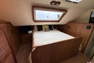 Slide: The Image of Cozy bedroom in 2006 Endeavour 44 TrawlerCat with wood paneling and skylight. - 18