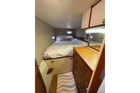 Slide: The Image of Cozy bedroom in 2006 Endeavour 44 TrawlerCat with bed, drawers, and natural light. - 24