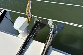 Slide: The Image of 2006 Endeavour 44 TrawlerCat anchor system on deck, featuring dual anchors and railing. - 28