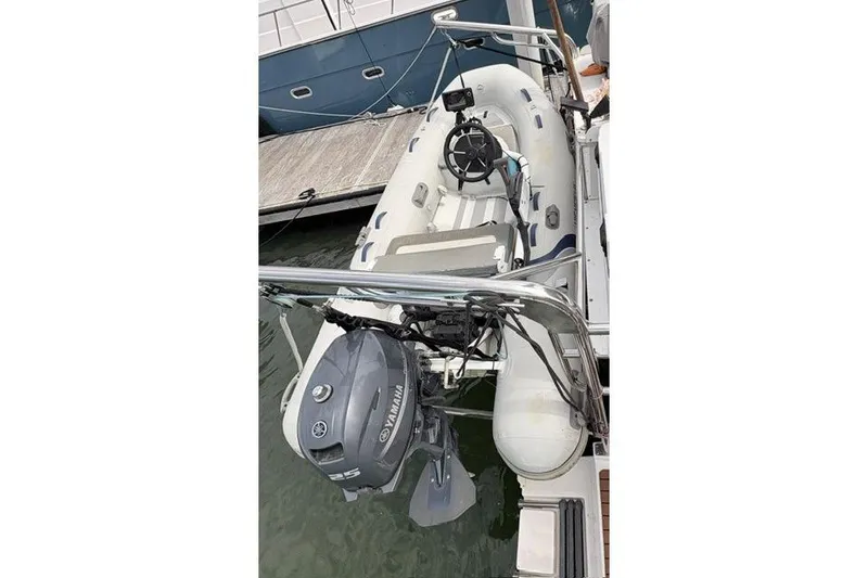 Slide: The Image of Inflatable dinghy with Yamaha outboard motor, docked beside Endeavour 44 TrawlerCat, 2006 model. - 30