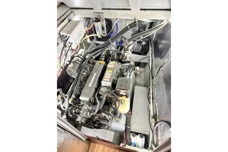 Slide: The Image of Engine compartment of a 2006 Endeavour 44 TrawlerCat, featuring a Yanmar engine. - 31