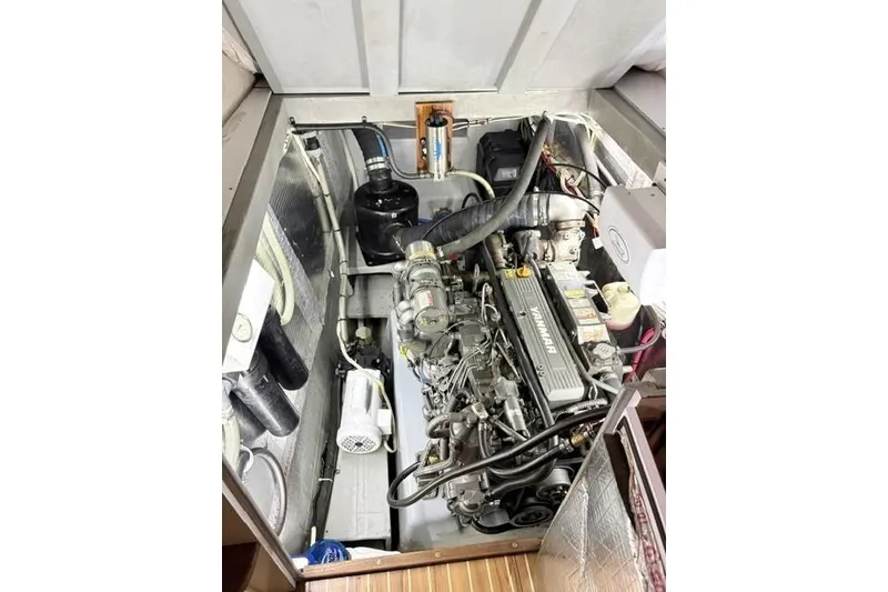 Slide: The Image of Engine compartment of a 2006 Endeavour 44 TrawlerCat, showcasing mechanical components. - 32