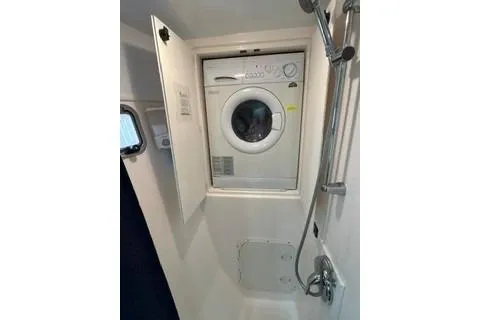 Slide: The Image of 2006 Endeavour 44 TrawlerCat laundry area with washer and shower. - 34
