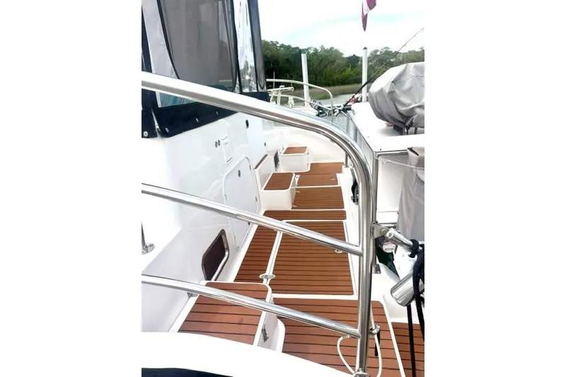 Slide: The Image of 2006 Endeavour 44 TrawlerCat deck with wooden flooring and stainless steel railings. - 35