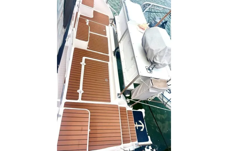 Slide: The Image of 2006 Endeavour 44 TrawlerCat deck with teak flooring and covered equipment. - 37