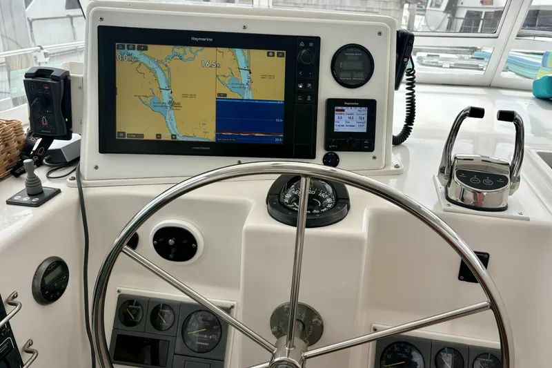 Slide: The Image of Helm of 2006 Endeavour 44 TrawlerCat with navigation equipment and steering wheel. - 39