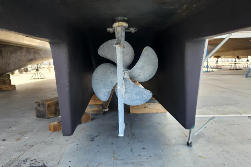 Slide: The Image of Propeller of 2006 Endeavour 44 TrawlerCat on dry dock, showcasing marine engineering. - 45