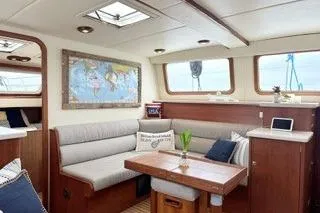 Slide: The Image of Interior of 2006 Endeavour 44 TrawlerCat with cozy seating and nautical decor. - 7