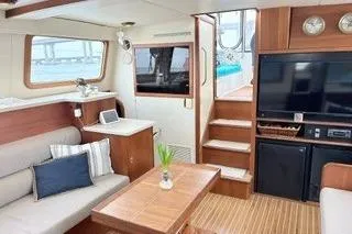 Slide: The Image of Interior of 2006 Endeavour 44 TrawlerCat with modern furnishings and entertainment area. - 9