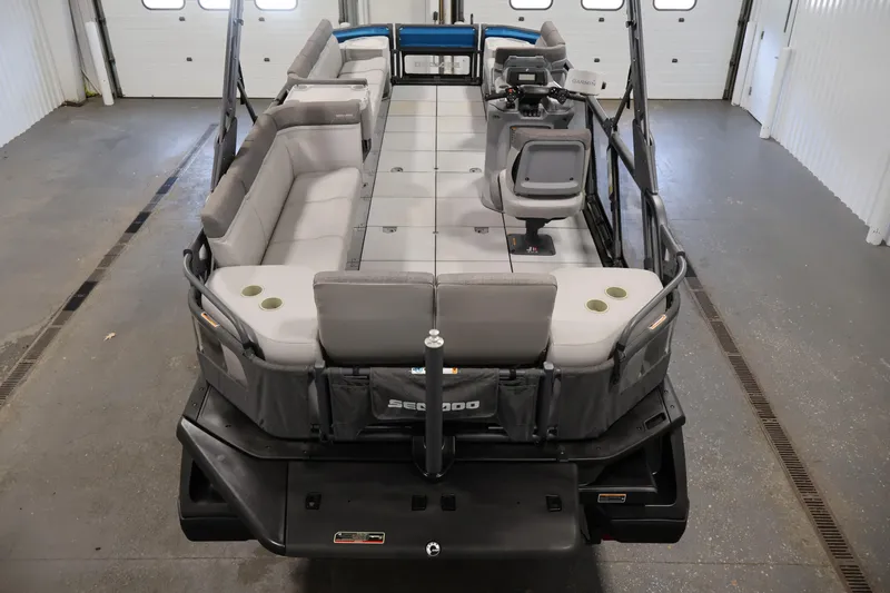 Slide: The Image of 2023 Sea-Doo Switch Cruise 21 pontoon boat interior with spacious seating and helm. - 10
