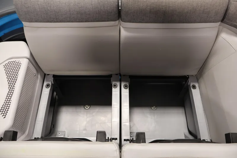Slide: The Image of 2023 Sea-Doo Switch Cruise 21 storage compartments under gray seats. - 13