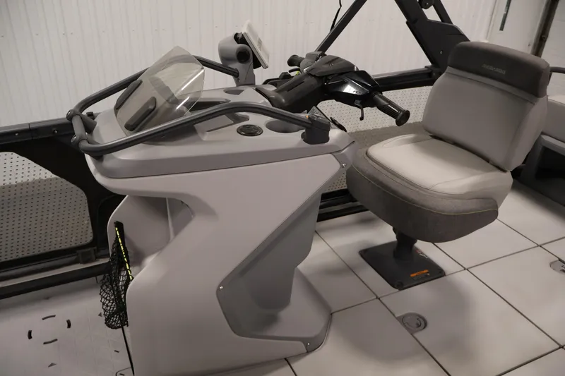 Slide: The Image of 2023 Sea-Doo Switch Cruise 21 helm with steering controls and comfortable seating. - 14