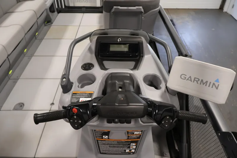 Slide: The Image of 2023 Sea-Doo Switch Cruise 21 dashboard with Garmin navigation system and controls. - 15