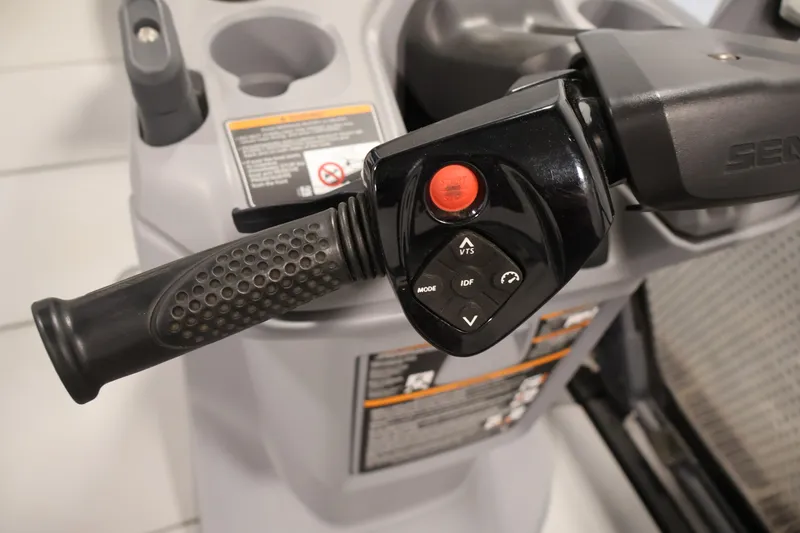 Slide: The Image of Close-up of 2023 Sea-Doo Switch Cruise 21 handlebar controls with buttons and grip. - 16