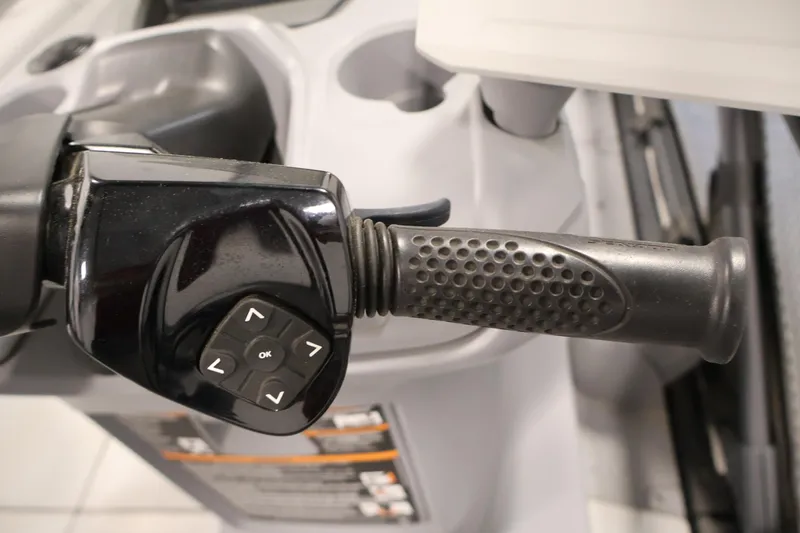 Slide: The Image of Close-up of 2023 Sea-Doo Switch Cruise 21 handlebar with control buttons. - 17