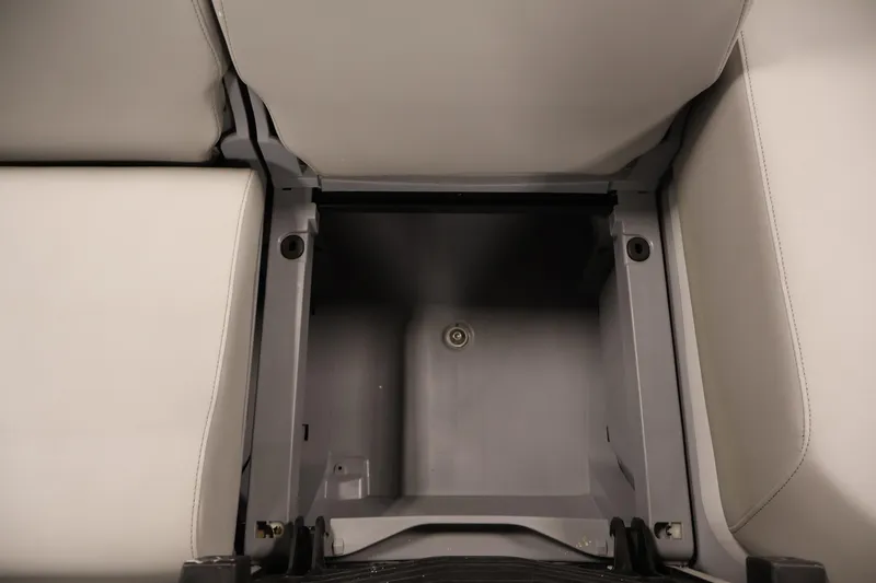 Slide: The Image of 2023 Sea-Doo Switch Cruise 21 storage compartment with open seating area. - 26