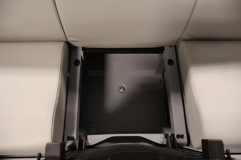 Slide: The Image of 2023 Sea-Doo Switch Cruise 21 storage compartment with cushioned seating. - 27