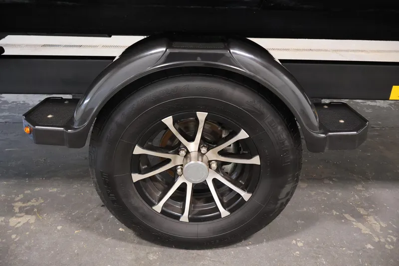 Slide: The Image of 2023 Sea-Doo Switch Cruise 21 trailer wheel with black fender and step. - 34