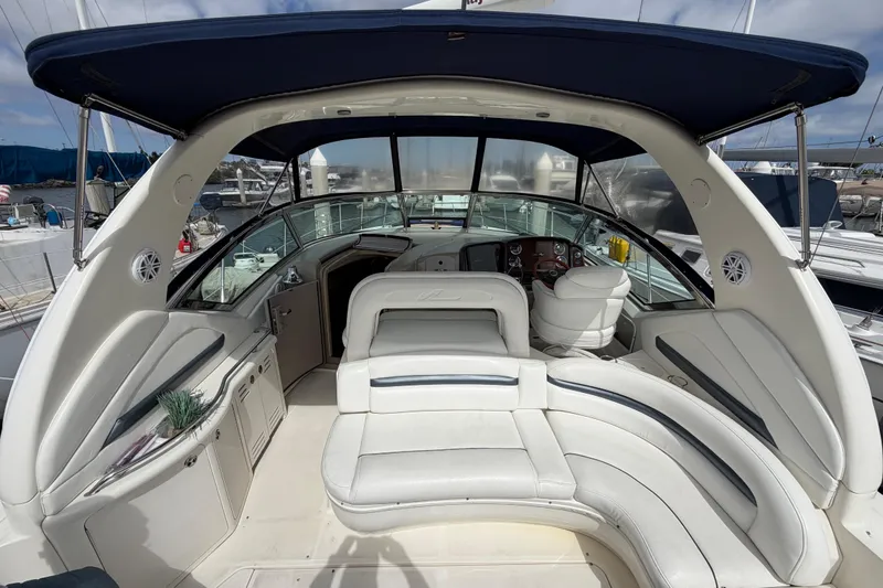 Slide: The Image of Luxurious 2003 Sea Ray 420 Sundancer yacht interior with spacious seating and helm. - 10