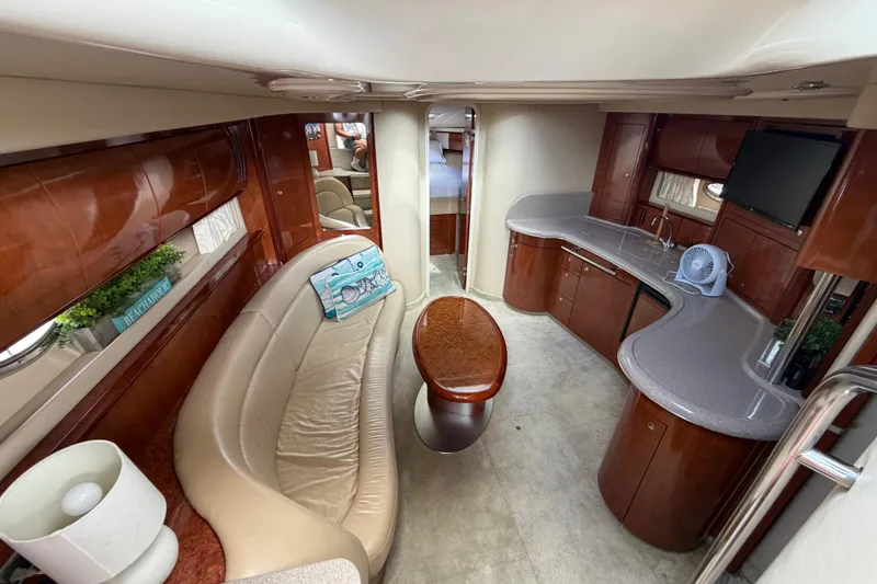 Slide: The Image of Luxurious interior of a 2003 Sea Ray 420 Sundancer yacht with elegant wood finishes. - 13