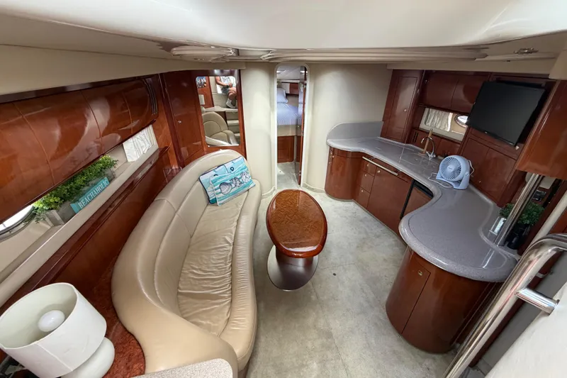Slide: The Image of Luxurious interior of 2003 Sea Ray 420 Sundancer yacht with elegant seating and modern amenities. - 14