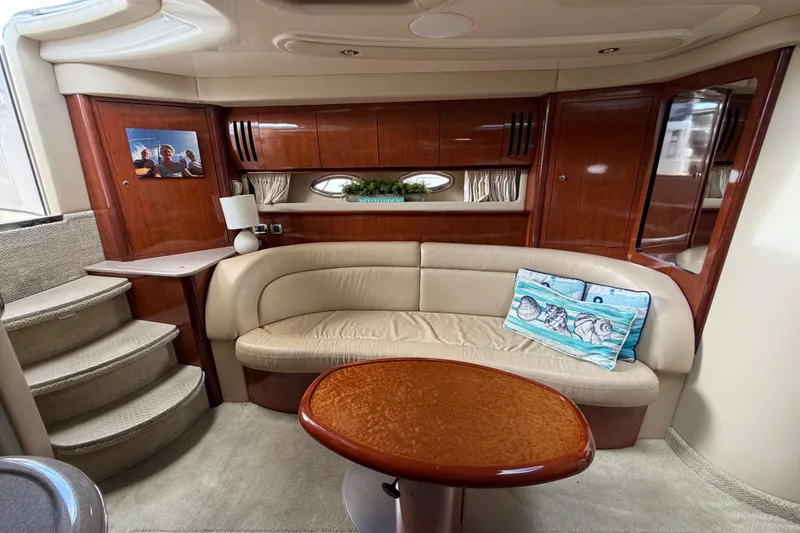 Slide: The Image of Luxurious interior of 2003 Sea Ray 420 Sundancer yacht with plush seating and elegant wood finishes. - 15