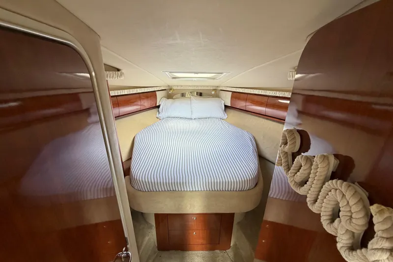Slide: The Image of Luxurious cabin interior of 2003 Sea Ray 420 Sundancer yacht with cozy bed. - 18