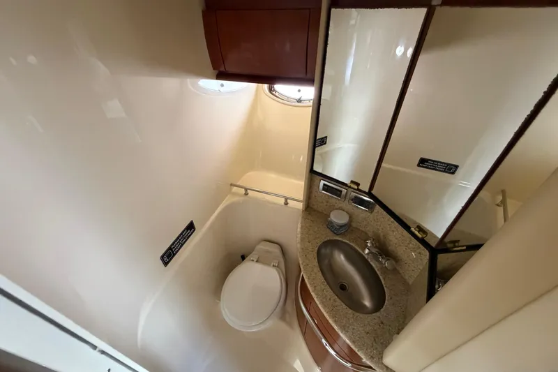 Slide: The Image of Bathroom interior of 2003 Sea Ray 420 Sundancer yacht with sink and toilet. - 19
