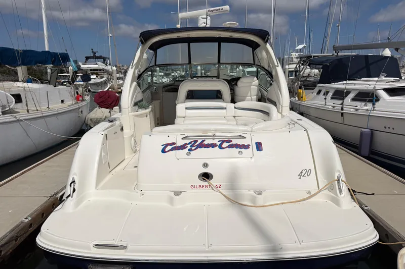Slide: The Image of 2003 Sea Ray 420 Sundancer yacht docked at marina, rear view. - 2