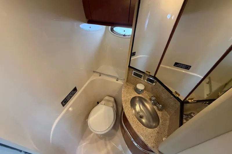 Slide: The Image of Bathroom interior of 2003 Sea Ray 420 Sundancer yacht with sink and toilet. - 20