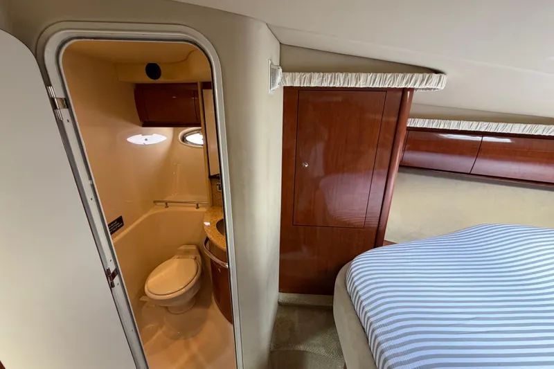 Slide: The Image of Interior of 2003 Sea Ray 420 Sundancer yacht showing bathroom and bedroom. - 21