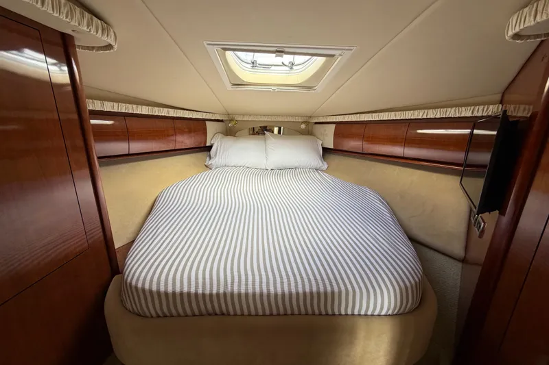 Slide: The Image of Luxurious cabin interior of 2003 Sea Ray 420 Sundancer yacht with cozy bed. - 22