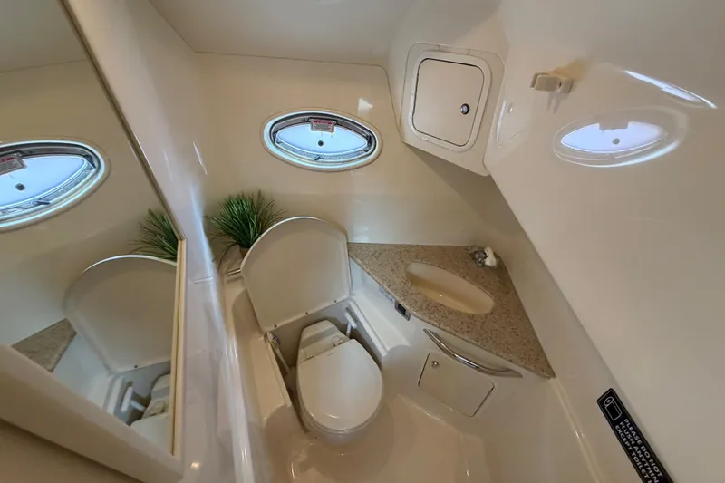 Slide: The Image of Luxurious bathroom in 2003 Sea Ray 420 Sundancer yacht with modern amenities. - 26
