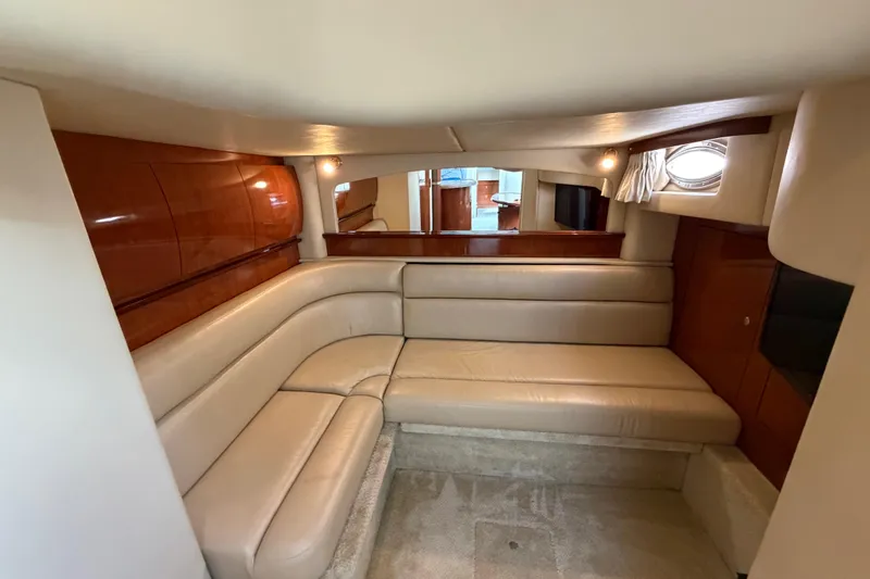 Slide: The Image of Luxurious interior of 2003 Sea Ray 420 Sundancer yacht with beige leather seating. - 28