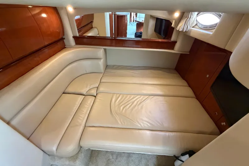 Slide: The Image of Luxurious interior cabin of 2003 Sea Ray 420 Sundancer yacht with leather seating. - 29