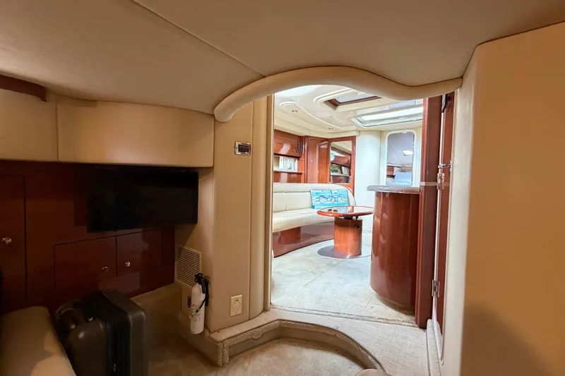 Slide: The Image of Luxurious interior of 2003 Sea Ray 420 Sundancer yacht with elegant seating and wood finishes. - 31