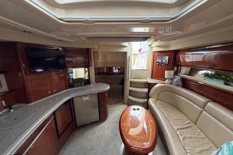 Slide: The Image of Luxurious interior of 2003 Sea Ray 420 Sundancer yacht with elegant seating and modern amenities. - 33