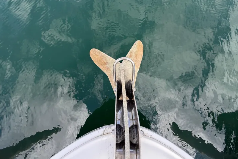 Slide: The Image of Bow view of 2003 Sea Ray 420 Sundancer with anchor over calm water. - 41