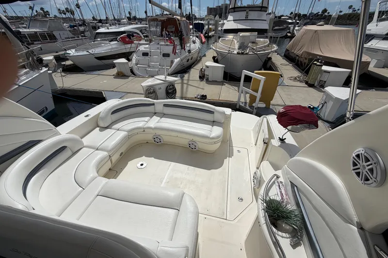 Slide: The Image of 2003 Sea Ray 420 Sundancer yacht with spacious seating at marina dock. - 5