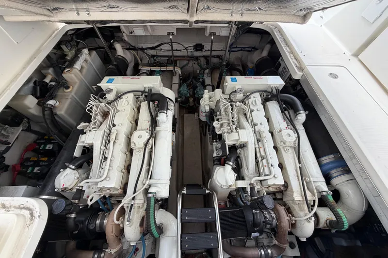 Slide: The Image of Engine room of a 2003 Sea Ray 420 Sundancer with twin engines. - 52