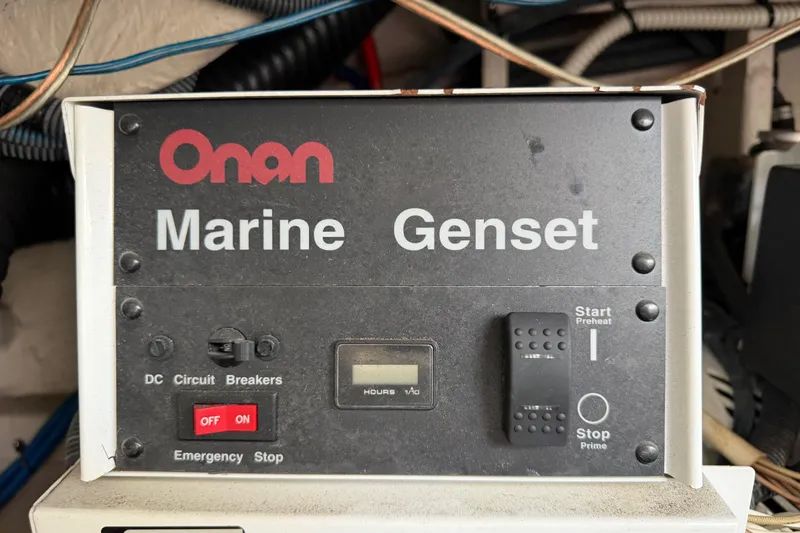 Slide: The Image of Onan Marine Genset control panel on 2003 Sea Ray 420 Sundancer yacht. - 59