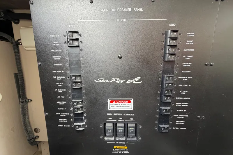 Slide: The Image of Main DC breaker panel of 2003 Sea Ray 420 Sundancer yacht with labeled switches. - 60