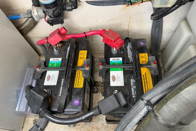 Slide: The Image of Marine batteries in a 2003 Sea Ray 420 Sundancer engine compartment. - 64