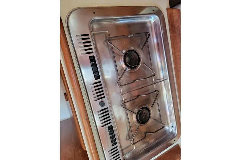 Slide: The Image of Stainless steel two-burner stove on a 1986 Pearson 28 sailboat. - 20