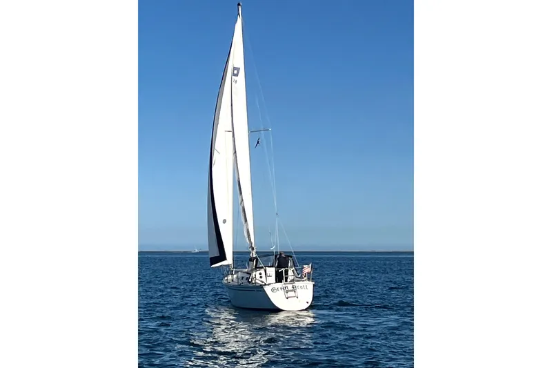 Slide: The Image of Sailboat on open water, Pearson 28 model, 1986, under clear blue sky. - 26
