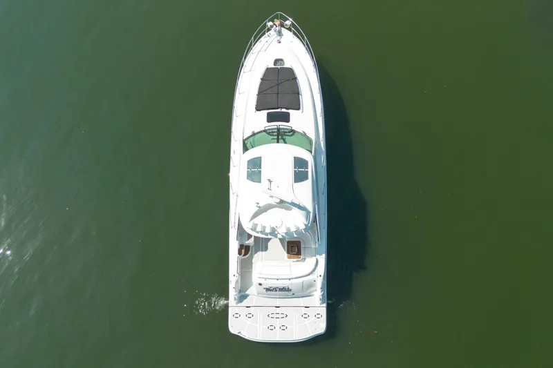 Slide: The Image of Aerial view of 2006 Sea Ray 48 Sundancer yacht on calm water. - 4