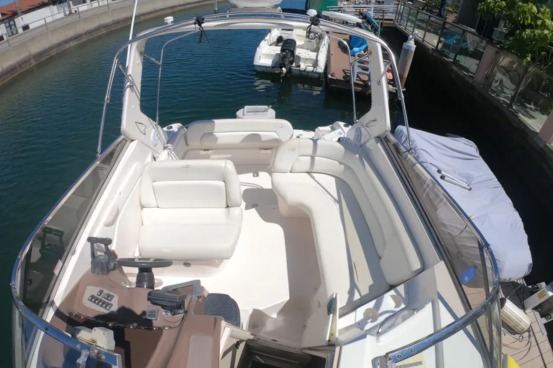 Slide: The Image of Interior of 2005 Regal Commodore 2860 boat with cozy bed and nautical decor. - 18