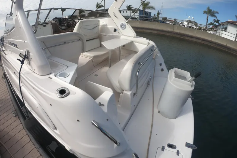 Slide: The Image of 2005 Regal Commodore 2860 boat docked, featuring spacious seating and sleek design. - 3